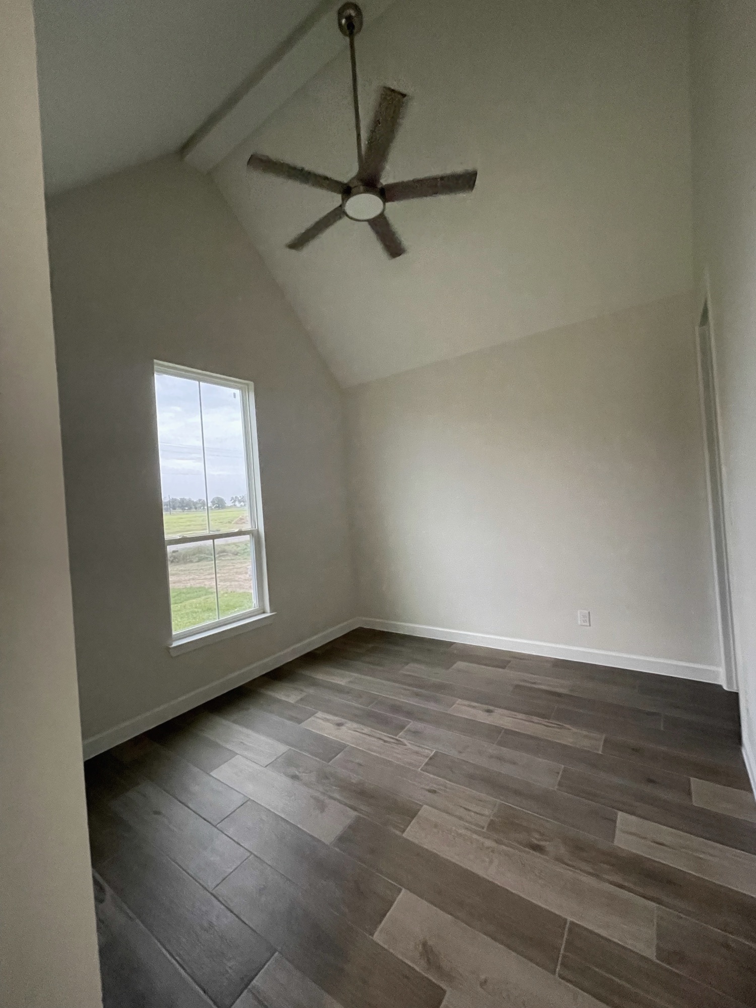 Bedroom with vaulted ceiling